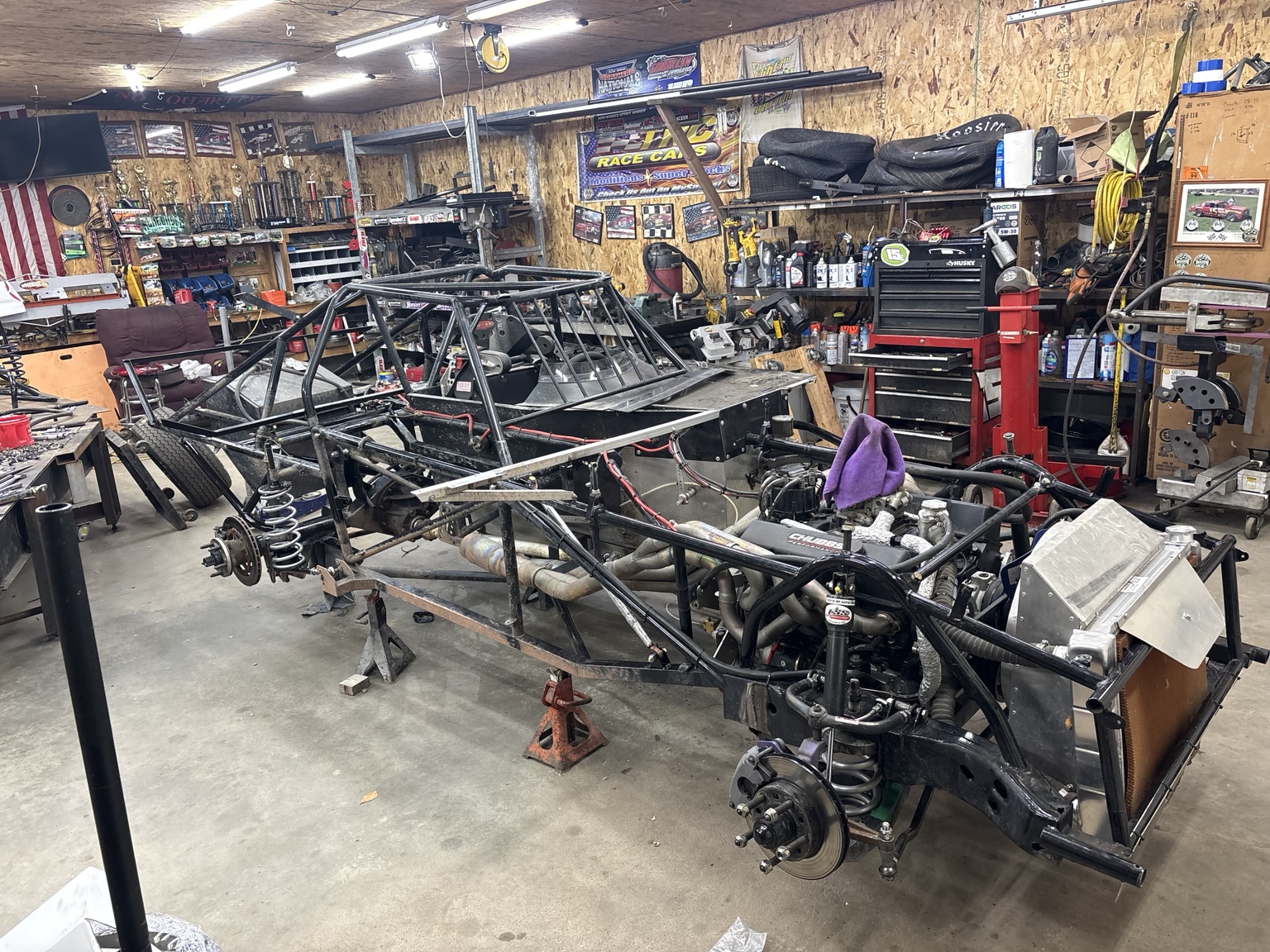 Late model stripped chassis in shop